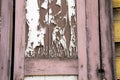 Wooden architecture of Siberia, old Windows with wooden carved architraves. old peeling paint on the wooden Windows Royalty Free Stock Photo