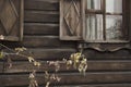 Wooden architecture of Siberia, old Windows with wooden carved architraves. old peeling paint on the wooden Windows Royalty Free Stock Photo