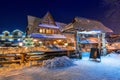 Wooden architecture of Zakopane at snowy night, Poland