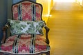 Wooden armchair with cushion & pillow on corridor hallway Royalty Free Stock Photo