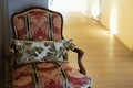 Wooden armchair with cushion & pillow on corridor hallway Royalty Free Stock Photo