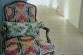 Wooden armchair with cushion & pillow on corridor hallway Royalty Free Stock Photo