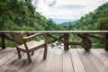 Wooden armchair on terrace inside rainforest