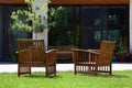 Wooden armchairs in beautiful garden