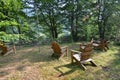 Wooden armchairs in green backyard