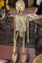 Wooden Articulated Puppet Sitting on a Bench Royalty Free Stock Photo