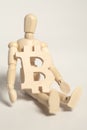 Wooden artist mannequin holding wooden sign bitcoin Royalty Free Stock Photo