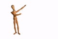 Wooden Artists Manikin pointing at copy space with white background