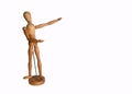 Wooden Artists Manikin on stand pointing at copy space with white background