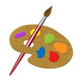 A wooden artists palette is seen with a paint brush and colors Royalty Free Stock Photo