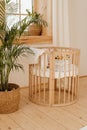 Wooden Baby Bed Crib in Eco Friendly Cozy Interior Royalty Free Stock Photo