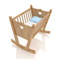 Wooden baby cradle with blue pillow isolated on white background Royalty Free Stock Photo