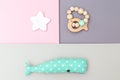Wooden baby toys and wooden baby teether on pastels background