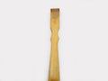 A wooden back scratcher on a white background, a hand shaped itch relief tool with long handle Royalty Free Stock Photo