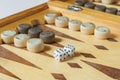 Wooden backgammon board with dice closeup Royalty Free Stock Photo