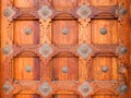 Wooden background of ancient old carved wood door and work with metallic ornaments Royalty Free Stock Photo