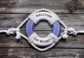 Wooden background with blue and white life preserver for maritime concepts. Royalty Free Stock Photo