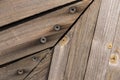 Wooden background of boards with iron bolts covered with rust. bottom of a Viking boat. the backdrop for the designer Royalty Free Stock Photo