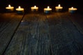 Wooden background with bokeh with candles