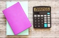 A calculator with the inscription makings and notebook