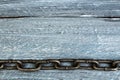 Wooden background with chain. Copy space for text.