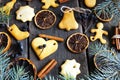 on a wooden background Christmas cookies, cinnamon, oranges, tree Royalty Free Stock Photo
