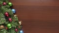 Wooden background with copy space and christmas ornaments and lights