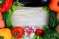 A wooden background framed with vegetables Royalty Free Stock Photo