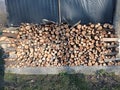 Wooden background. Firewood for the winter, stacks of firewood . Chopped wood logs for sale use in fire place at home stored on Royalty Free Stock Photo