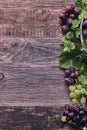 Wooden Background with Grapes and Vines