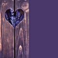 Wooden background with heart and flowers of lavender with space for your text Royalty Free Stock Photo