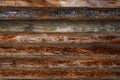 Wooden background. Log cabin wall background. Old weathered orange logs Royalty Free Stock Photo