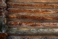 Wooden background. Log house wall background. Old weathered orange logs Royalty Free Stock Photo