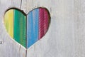 Wooden background with multicolor rainbow heart gay pride concept
