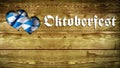 Wooden Background with Oktoberfest Slogan and heart-shaped cutout