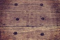 Wooden background of old wooden railway sleeper, rusty hexagon nut or iron screws Royalty Free Stock Photo