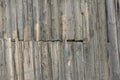 Wooden background.An old wooden fence made of unpainted boards with cracks and nails Royalty Free Stock Photo