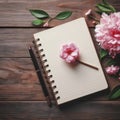 Wooden background with pink flower on blank notebook diary top view. ai generative