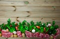 Wooden background with raw lamb, vegetables, greens Royalty Free Stock Photo