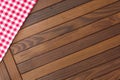 Wooden background with red and white checkered tablecloth Royalty Free Stock Photo