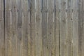 Wooden background.A rustic fence made of unpainted boards with slits and nails Royalty Free Stock Photo