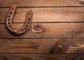 Wooden background with a rusty horseshoe Royalty Free Stock Photo