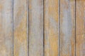 Wooden background of shabby boards with worn orange paint