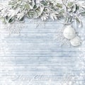 Wooden background with snowy branches and Christmas decorations