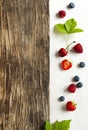 Wooden background with summer berries and copy space Royalty Free Stock Photo