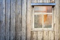 Wooden background. Wall of a barn with a window Royalty Free Stock Photo