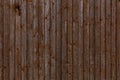 Wooden plank wall with a row of crosshead screws