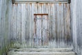 Wooden background. Weathered, ancient wooden door