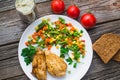 Breakfast on the wooden background from chicken breast