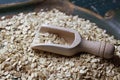 Wooden bailer with oat flakes